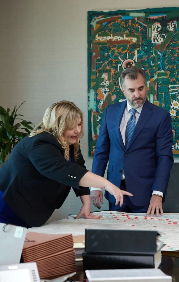 ashley liuzza pointing at a map