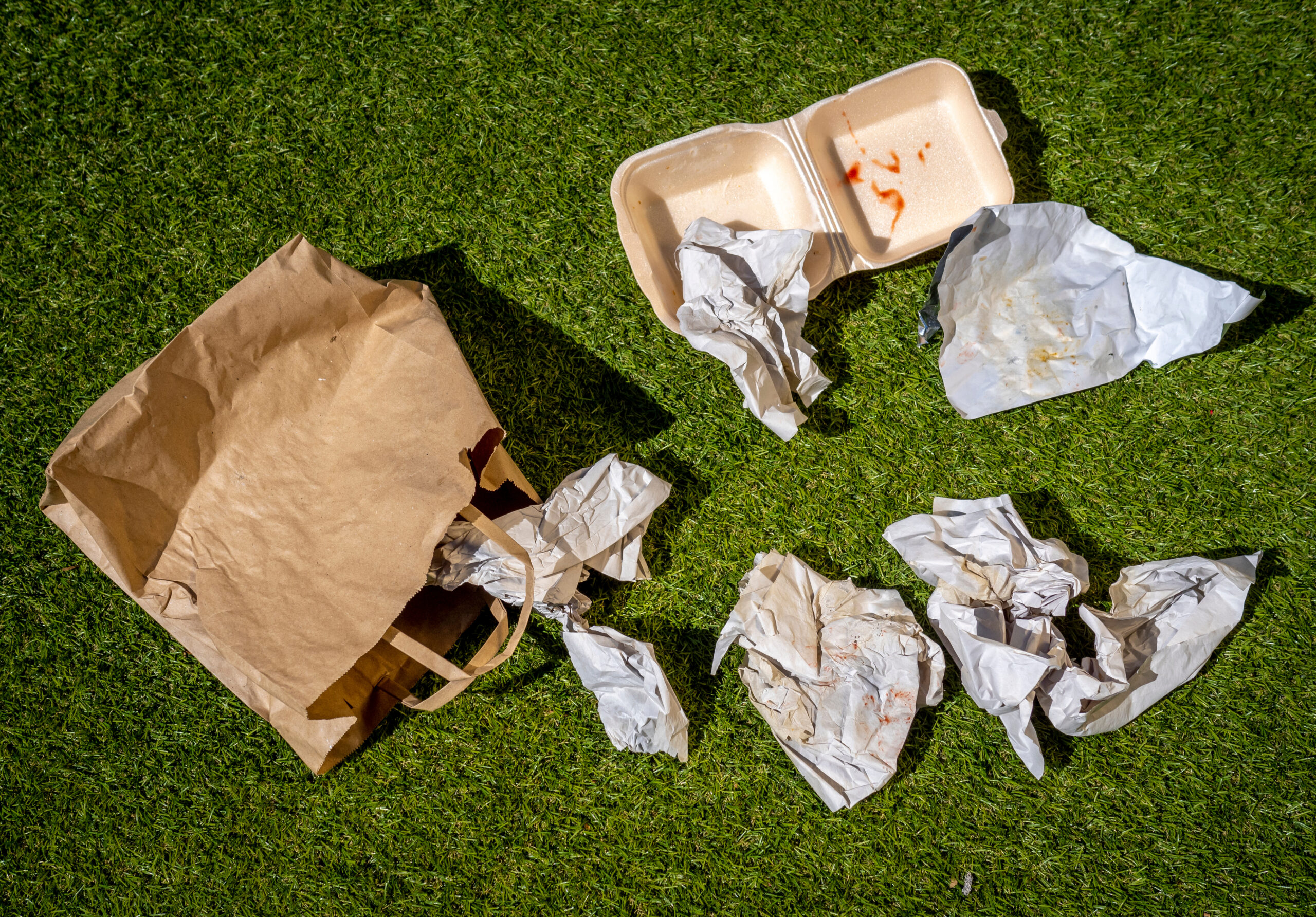 Discarded Fast Food Wrappers on Ground