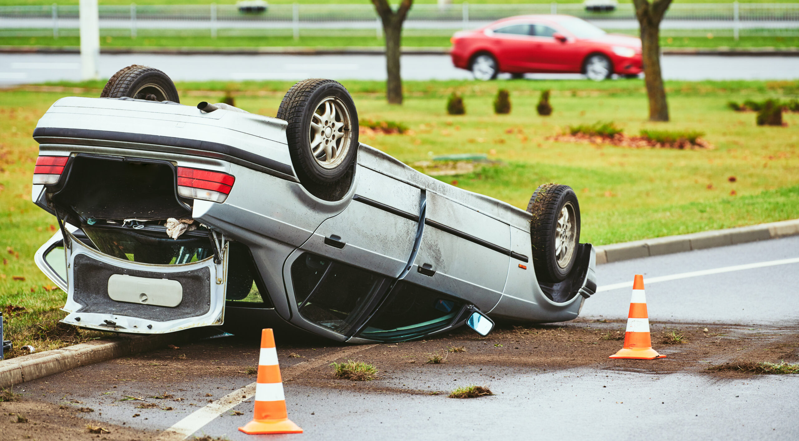 car crash accident. Car collision on city street. damaged automobile laying upside down